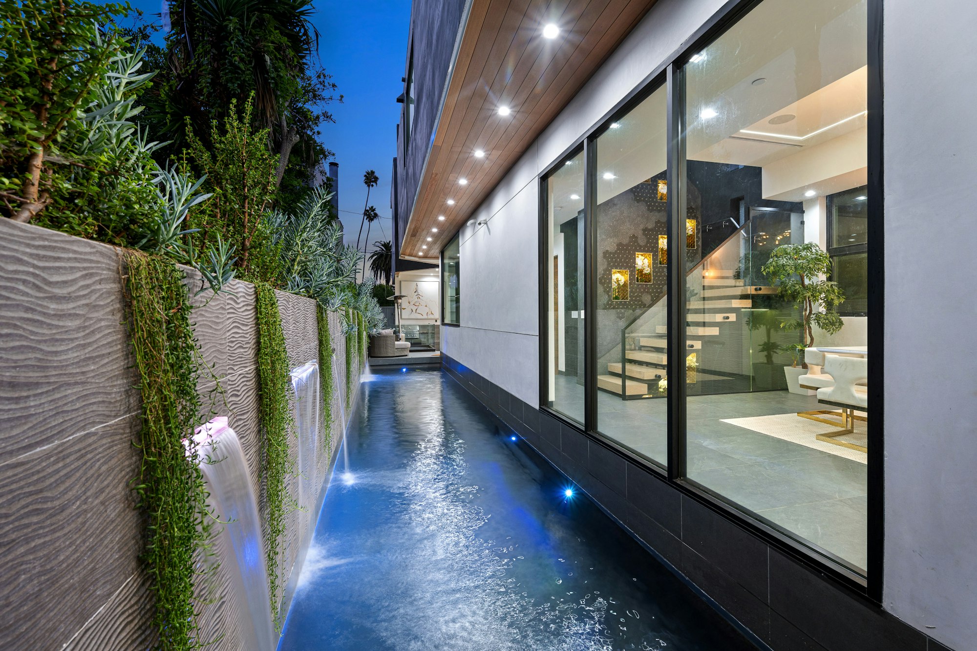 Contemporary residence with a pool in the side yard